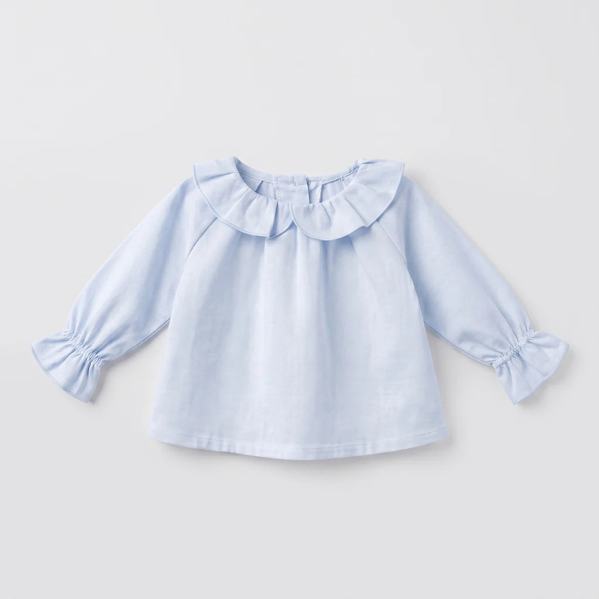 Blusa bebé celeste volante
