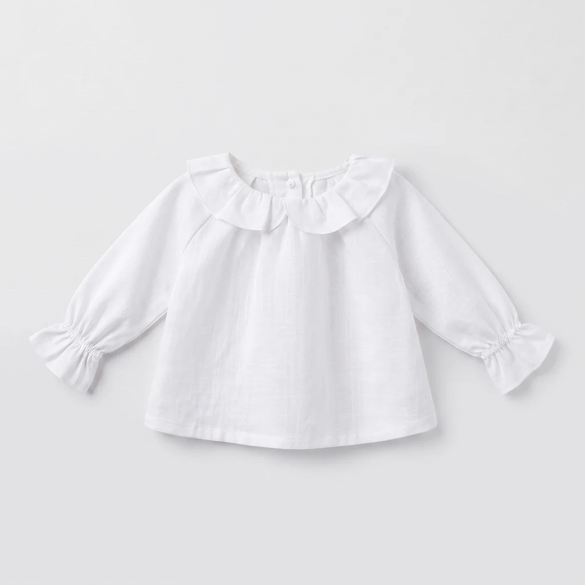 Blusa bebé blanca volante